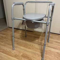 $40 NEW. NEVER USED Folding Commode 