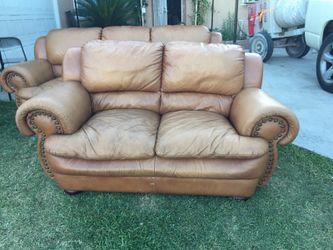 A pair of leather sofas