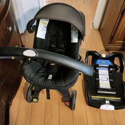 Doona Car Seat/Stroller With Base. Fontana Pickup.