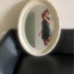 Antique, oval mirror