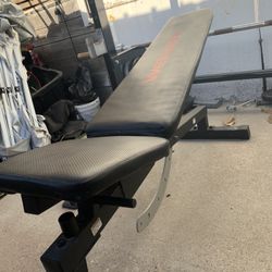 Squat rack/adjustable bench/300lb plate set/7ft olympic barbell