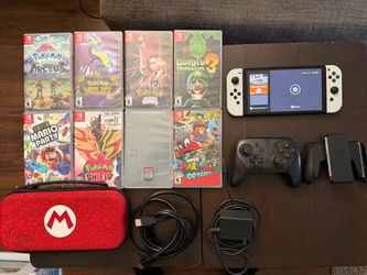 Nintendo Switch OLED Bundle + 8 Games