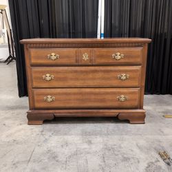 Brown Wood Three-Drawer Dresser with Brass Pulls