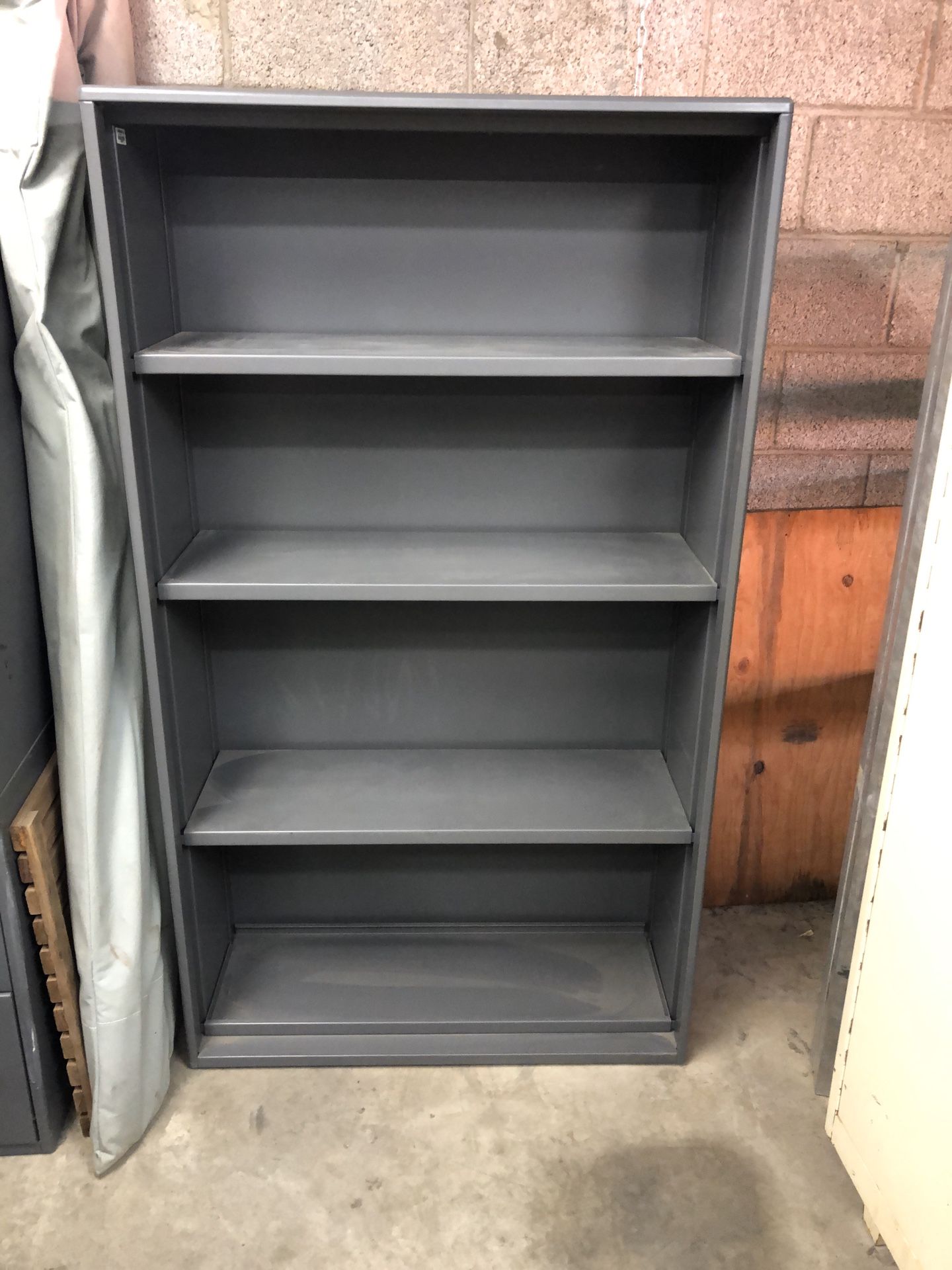 Storage cabinet and shelving units. Pick up tomorrow Thursday morning 10-12