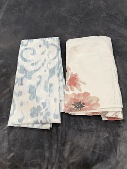 Two Patterned Shower Curtains