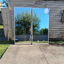 2 Mirrored Closet Doors, each of which measured at a width of 