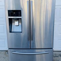 Samsung 28 cu. ft. swing door refrigerator with stainless steel cabinet.