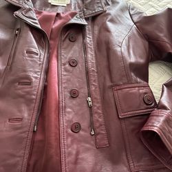 woman’s classy burgundy (wine color) leather jacket 