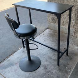 Bar height table with one stool