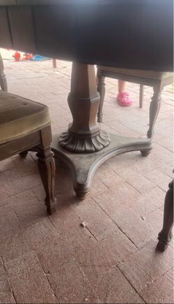 Round table with three add a leafs and 4 cane back chairs