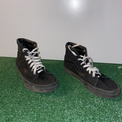 Black vans with white laces