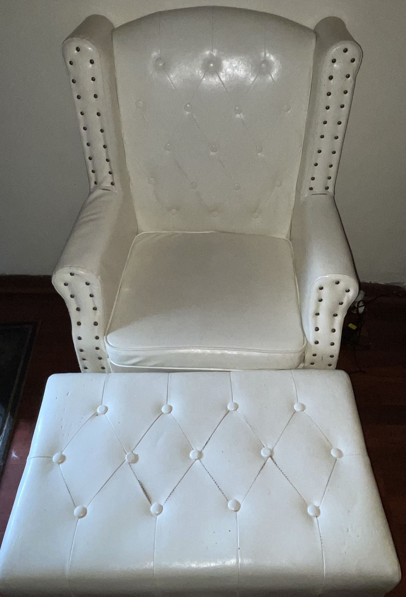 Faux leather armchair with ottoman