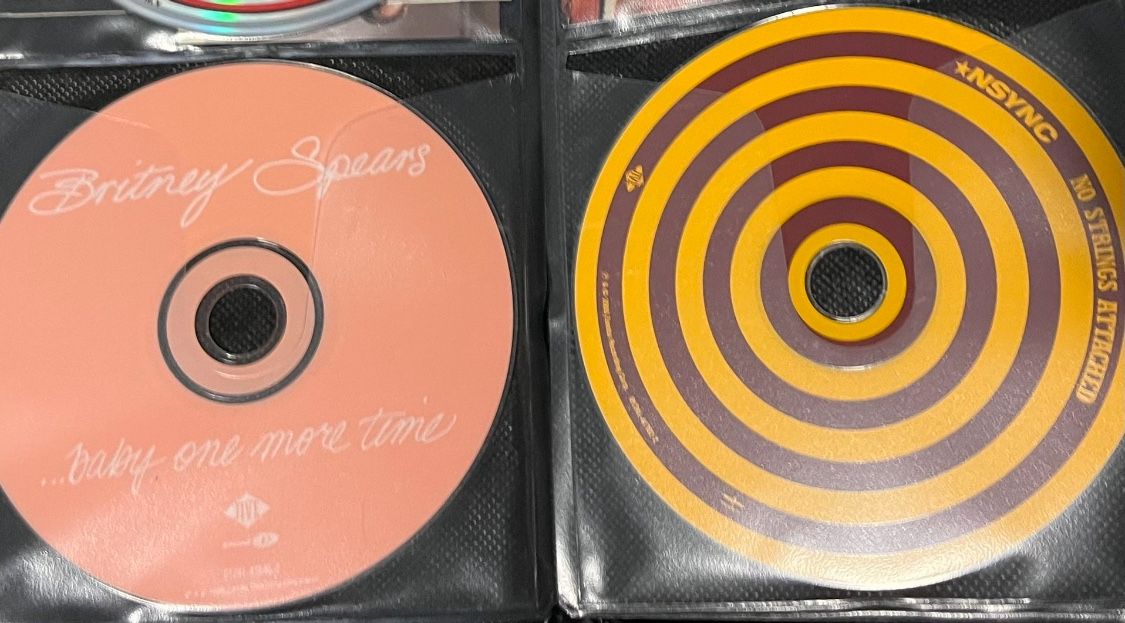 Brittney Spears And *NCYNC Package 2CDs. Hit me baby one more time and no strings attached! Great collection of songs. Includes 2 CDs and album notes