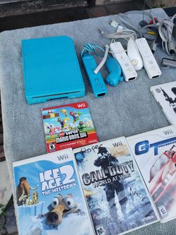 Nintendo wii Limited edition Sonic Blue. With all cables & sensors with 5 Great Games. 3 pair of controllers $200! Or trade up
