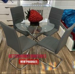 Round Glass Dining Table with 4 Gray Chairs