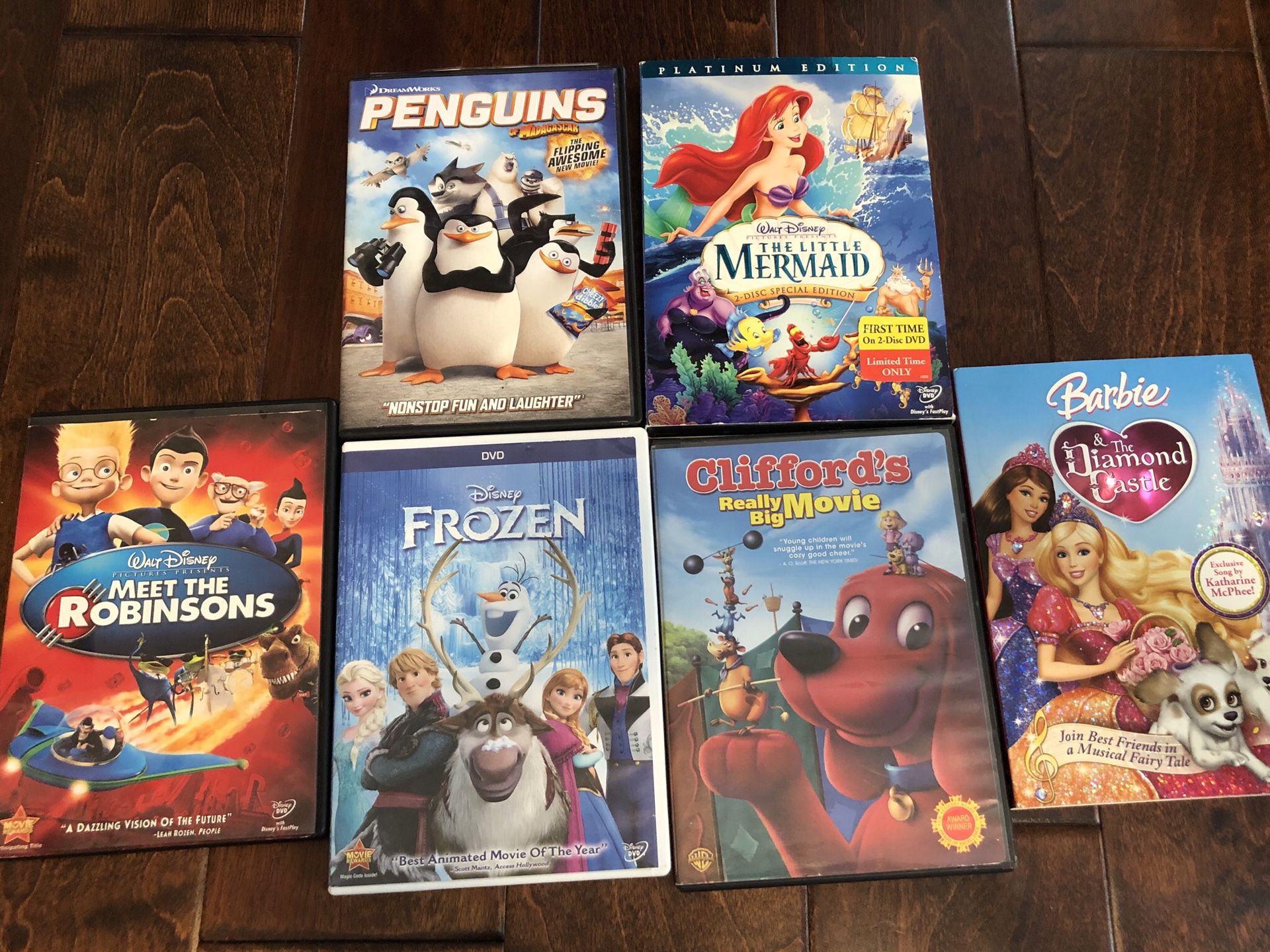 Set of 6 DVDs - The Little Mermaid, Penguins, Barbie, Meet the Robinsons, Frozen, Cliffords