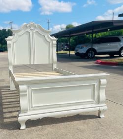 Antique white twin bed frame features a classically-styled headboard with sophisticated carving details: Twin Size Panel Bed Finish in an Antique Whit
