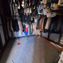 Whole storage unit for sale. Full of men's dress suits, military jackets and shirts, leather jackets and a bunch of glass trinkets and more