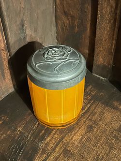 Antique glass jar with Decorative Metal Floral Lid