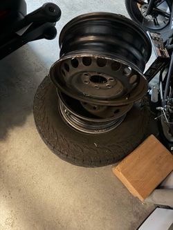 Tire and two rims for an RV with Mercedes caps
