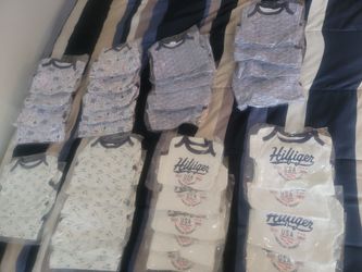 Brand NEW! Baby Onesies In Plastic