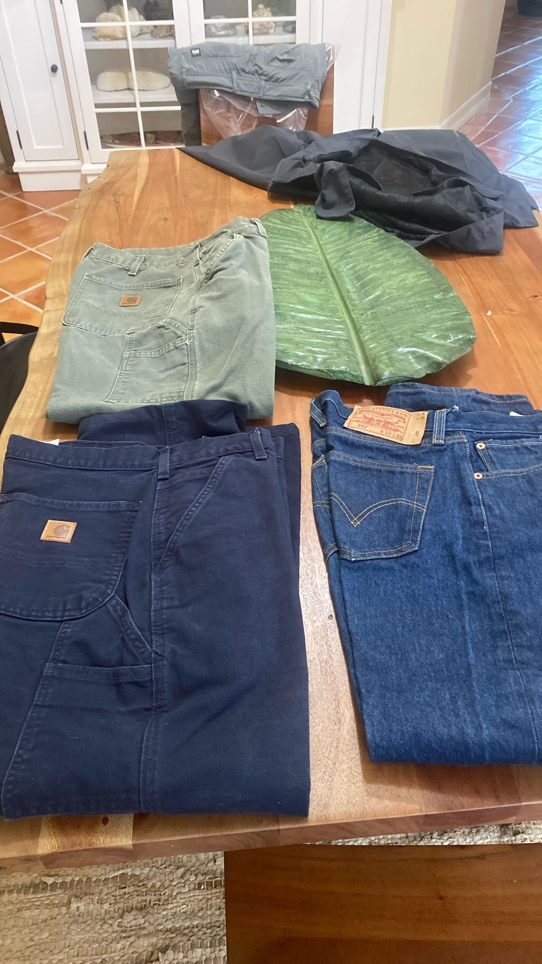 Men’s pants, one pair of Levi’s two pairs of Carhartt heavy work pants