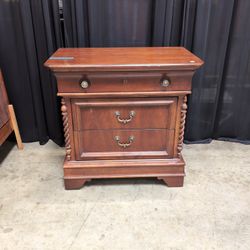 Cherry Finish Wood Nightstand with Ornate Hardware