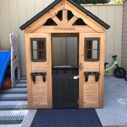 Backyard Discovery Sweetwater Cedar Wooden Kids Playhouse Cottage with Play Kitchen, Snack Bar, Half Door, Toy Phone, Windows, Flowerpot Holder 