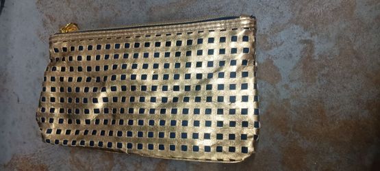 Brand new small, long gold clutch