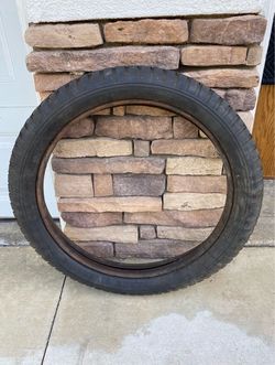 ANTIQUE FORD MODEL T TIRE W/ INNER RING (MAKES A GREAT WALL HANGER OR YARDART DISPLAY PIECE)