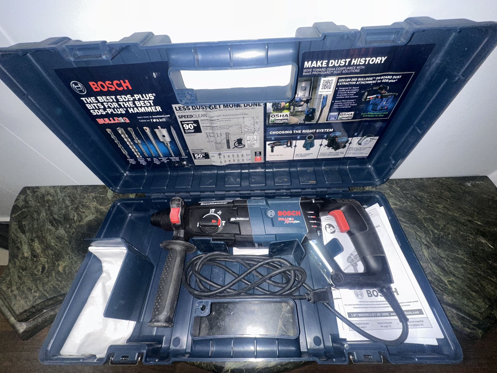 Bosch concrete/masonry Rotary Hammer Drill with carrying case.