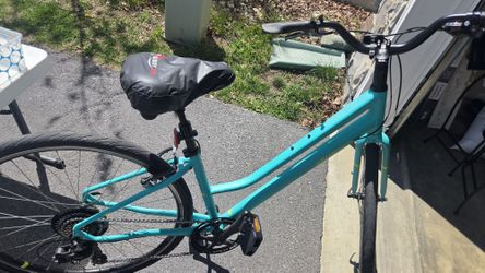 Womens Specialized light teal bike with accessories
