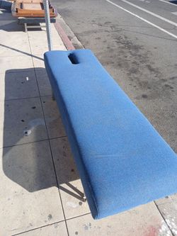 blue upholstered massage or chiropractic adjustment table