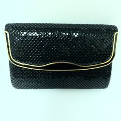 Clutch Purse black for evening wear with gold trim.  Great for wedding.  Has a long chain if you want to wear as shoulder purse.  Great for we