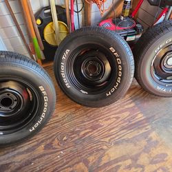 4 used BF Goodrich tires and rims fits Ford and Plymouth