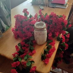 Two Bunches Of Flowers With Vase