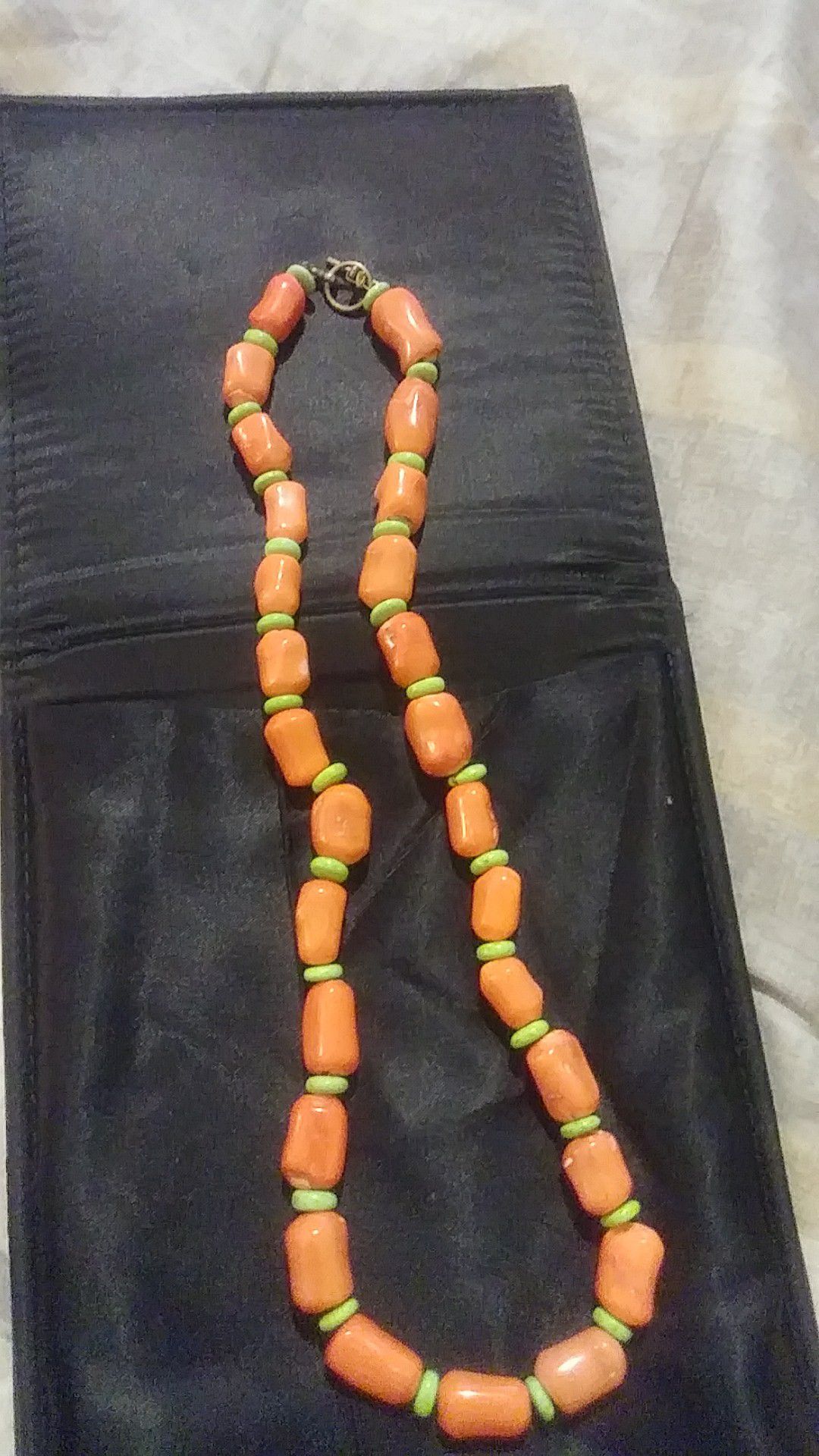 Chunky angel skin Natural coral 22" long necklace accented with greeen turquoise spacers and toggle clasp is a most unique piece