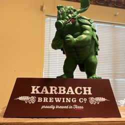 Karbach Beer can Stand With Statue