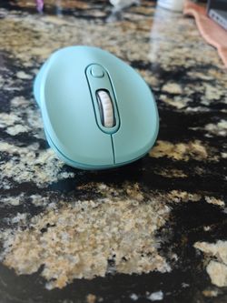 Mint colored wireless mouse