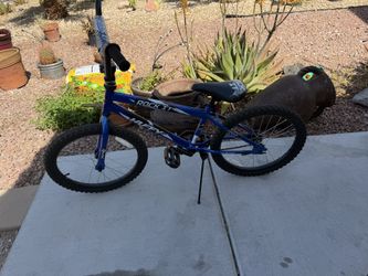 Huffy Rock It 20-inch Kids' Bicycle in royal blue. 