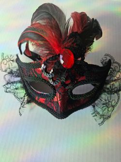 red and black lace masquerade mask decorated with black and red feathers