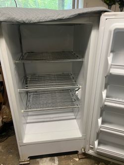 Upright Manual defrost freezer.