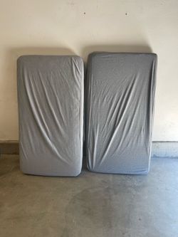 Two crib mattresses
