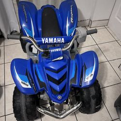 blue Yamaha Raptor ATV