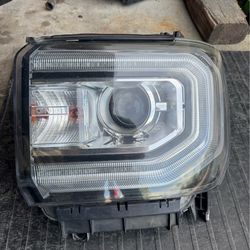GMC HEADLIGHT OEM