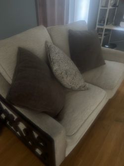 Beige Fabric Sofa with Dark Wood Frame