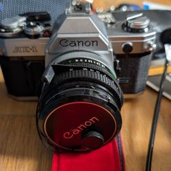 Canon AE-1 Manual Camera And Three Lenses 