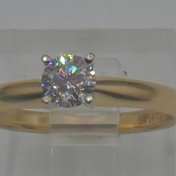 14KT YELLOW GOLD RING SIZE 5 2.1 GRAMS 0.33PTS ROUND DIAMOND SI2 G COLOR. NOTE ONE INCLUSION OFF CENTER.  879540-1.
