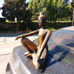 ANTIQUE WOODEN STATUE CARVED WOOD. SOME1 NOT ME REPAINTED AND TRIED TO RESTORE, I DIDNT DO THAT PAINT JOB