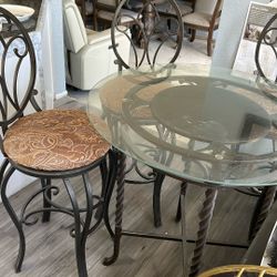 Glass round table with three chairs